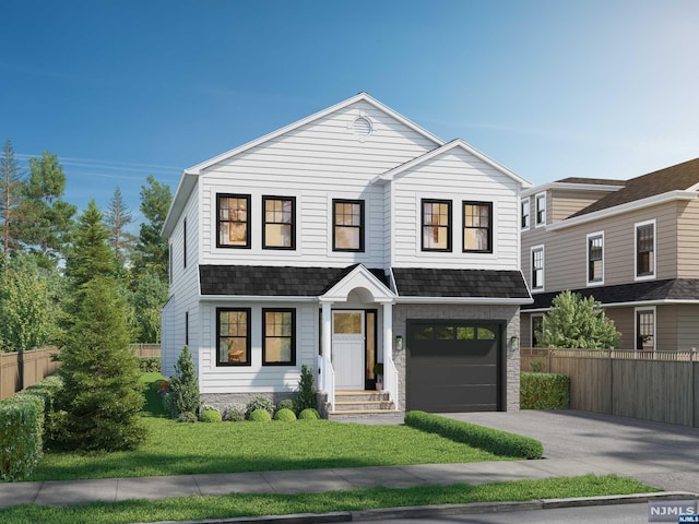 view of front facade with a garage and a front lawn