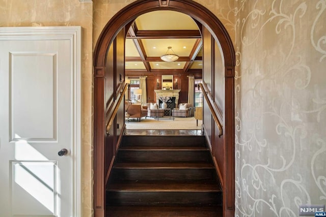 stairs with beam ceiling and coffered ceiling