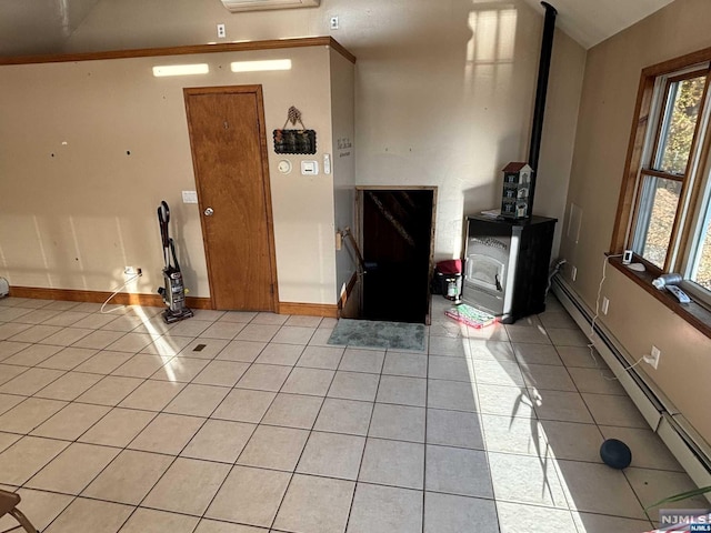 interior space with light tile patterned floors and a baseboard radiator