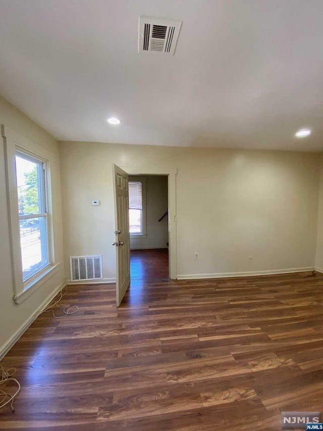 empty room featuring dark hardwood / wood-style floors