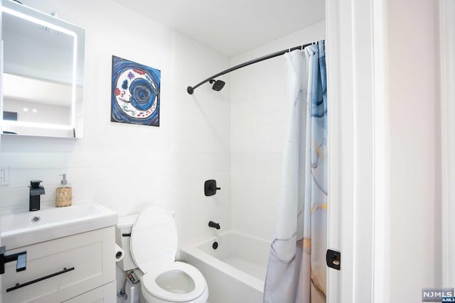 full bathroom featuring shower / bathtub combination with curtain, tasteful backsplash, toilet, vanity, and tile walls