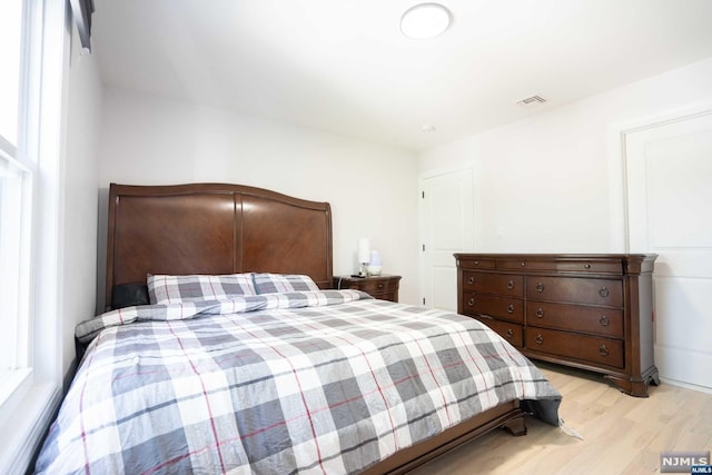 bedroom featuring light hardwood / wood-style floors