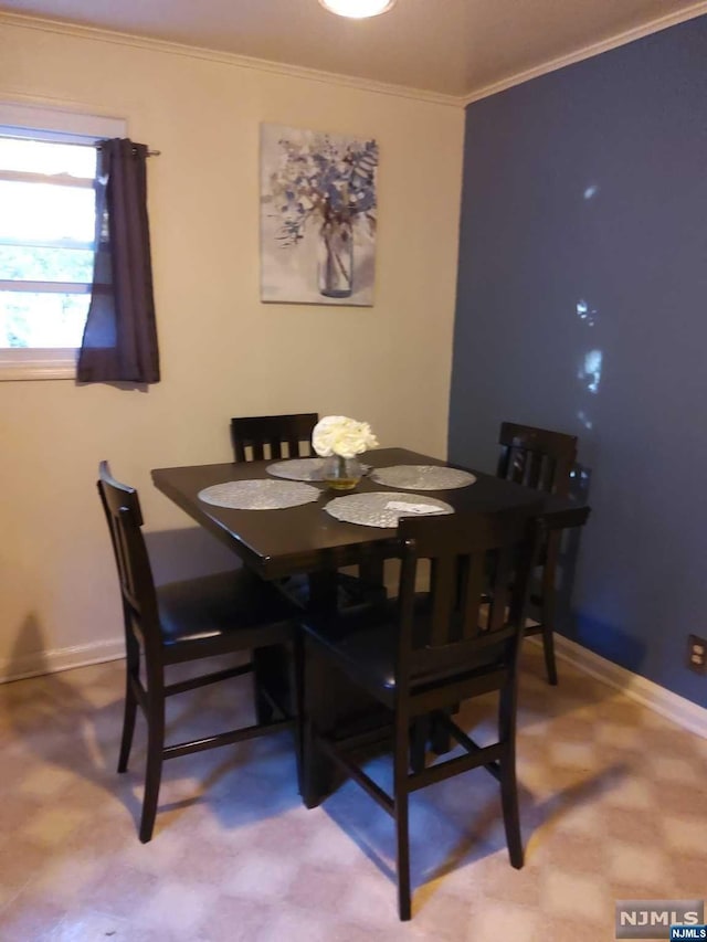 dining room featuring ornamental molding