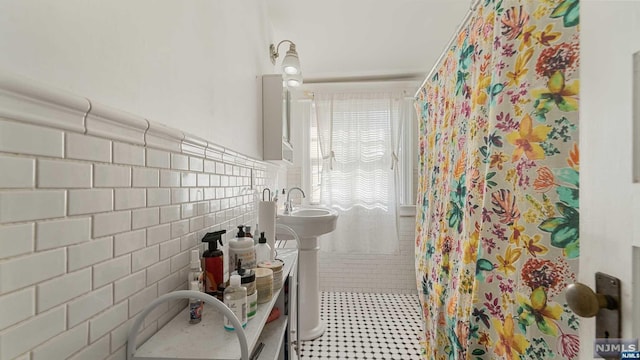 bathroom with tile walls