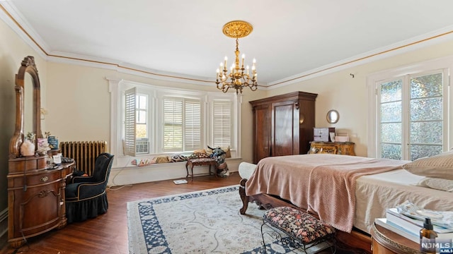 bedroom featuring dark hardwood / wood-style flooring, radiator heating unit, ornamental molding, and multiple windows