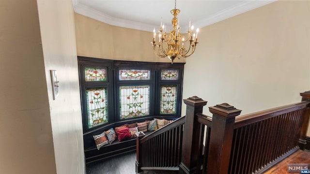 stairway with hardwood / wood-style flooring, a notable chandelier, and ornamental molding