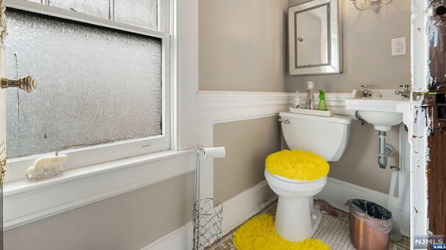 bathroom with tile patterned flooring and toilet