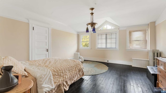 bedroom with radiator heating unit, dark hardwood / wood-style floors, and vaulted ceiling