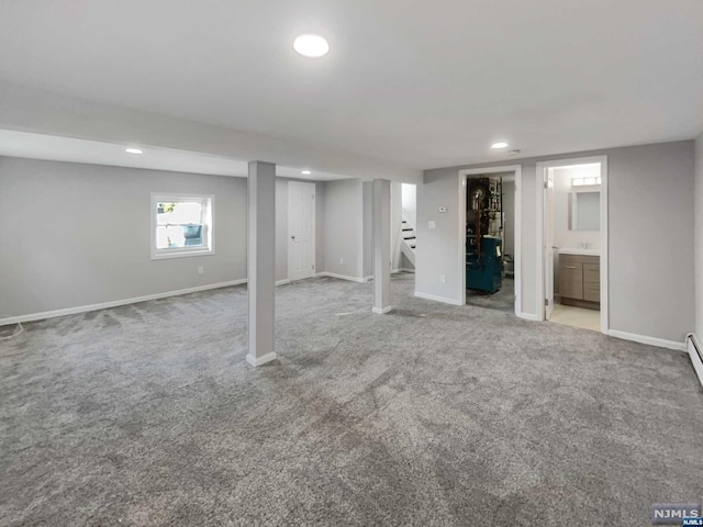 basement featuring light colored carpet