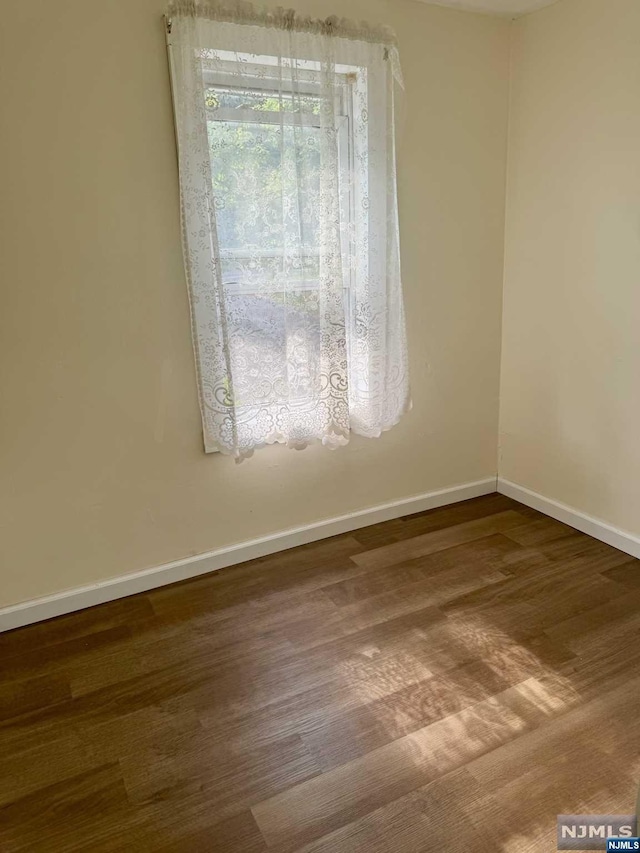 empty room featuring hardwood / wood-style floors