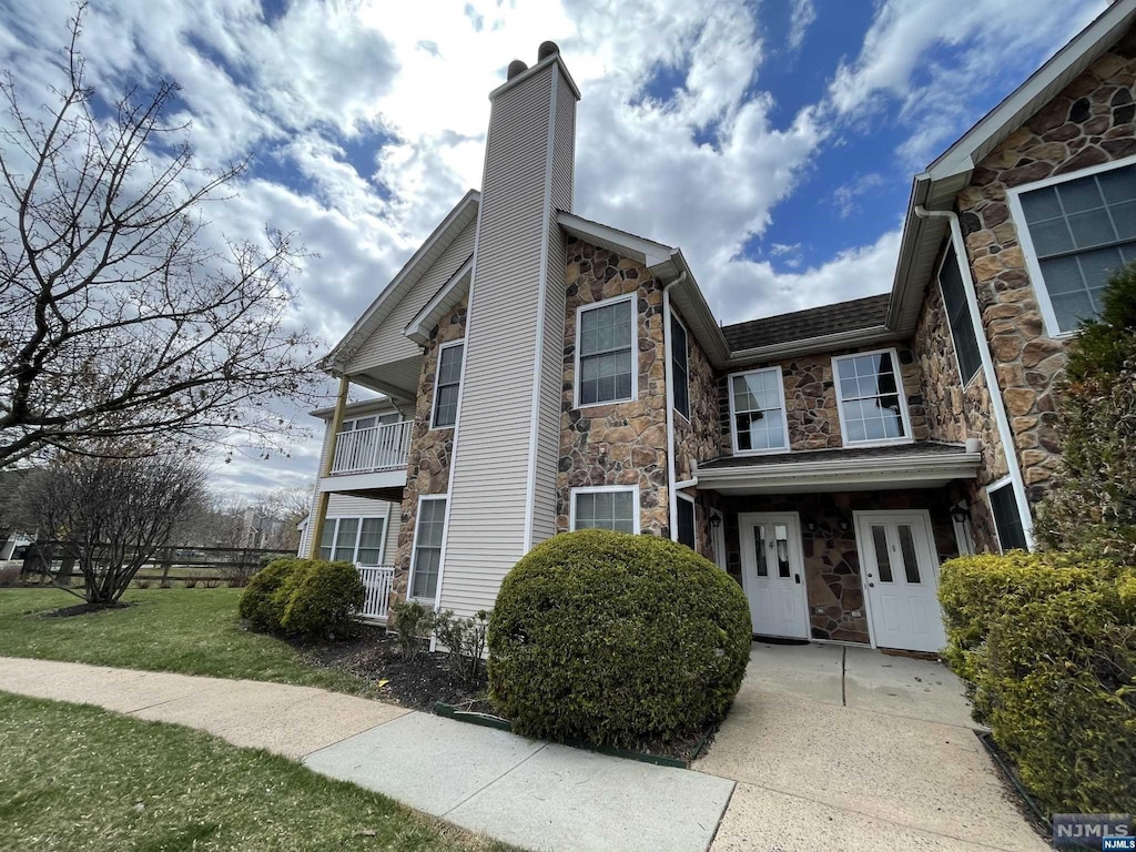 view of home's exterior featuring a lawn