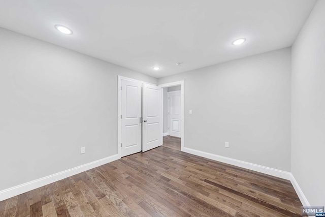 unfurnished bedroom featuring hardwood / wood-style floors