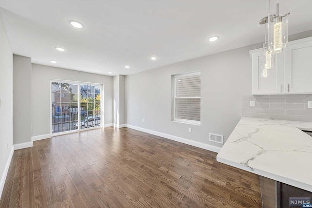 interior space with dark hardwood / wood-style floors