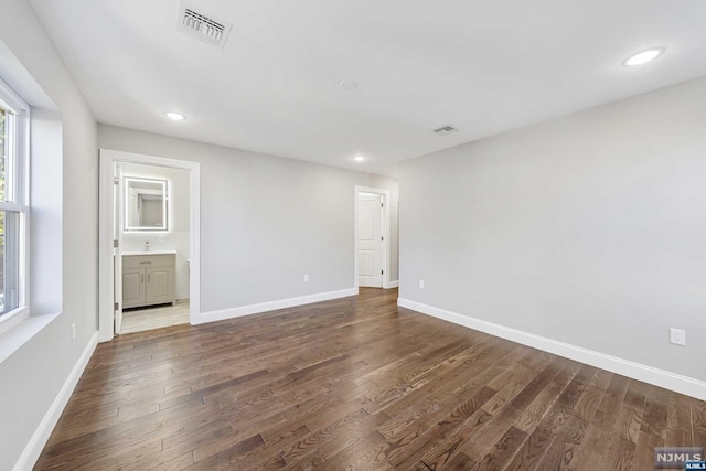 unfurnished room featuring dark hardwood / wood-style flooring