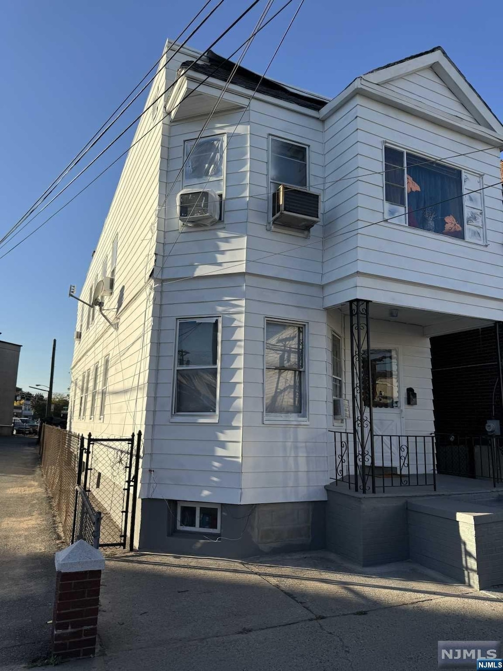 view of front of house featuring cooling unit