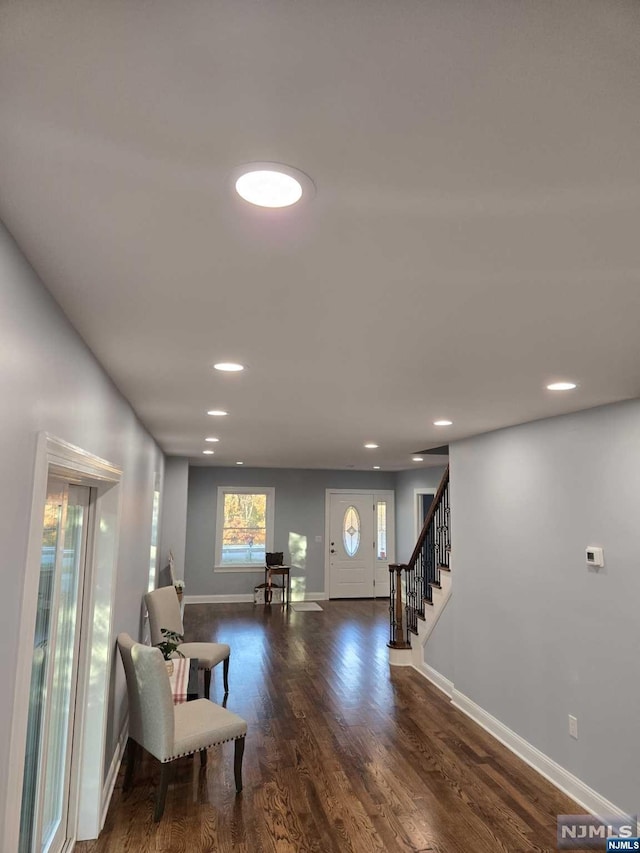 interior space with dark hardwood / wood-style flooring