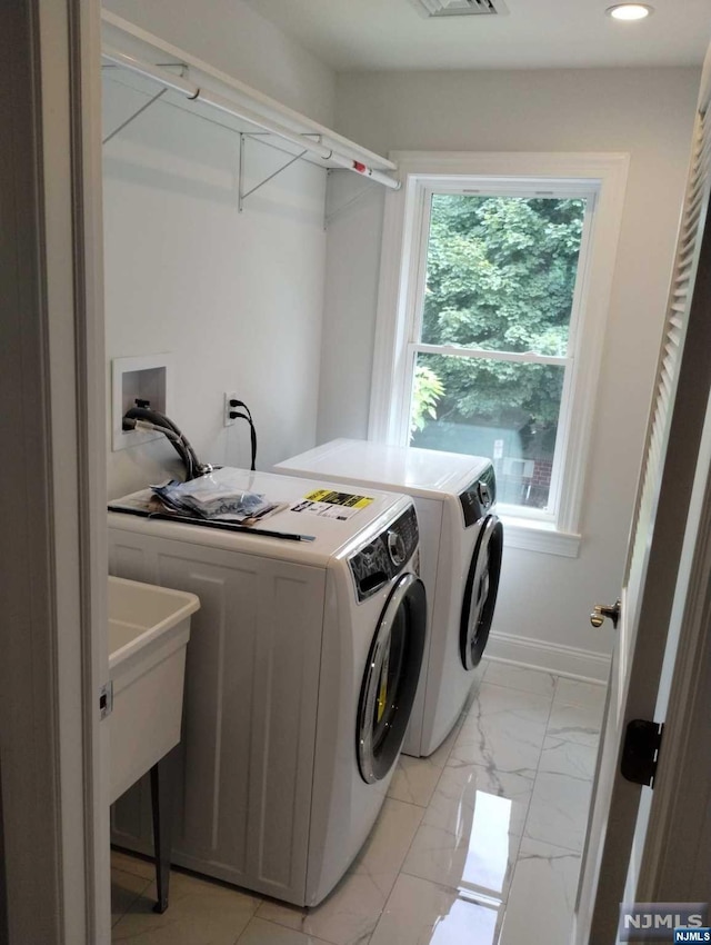 washroom with washing machine and dryer