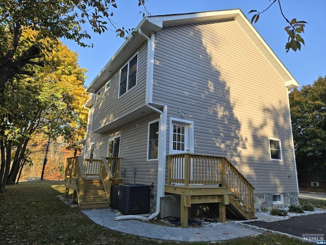 view of home's exterior with central AC unit