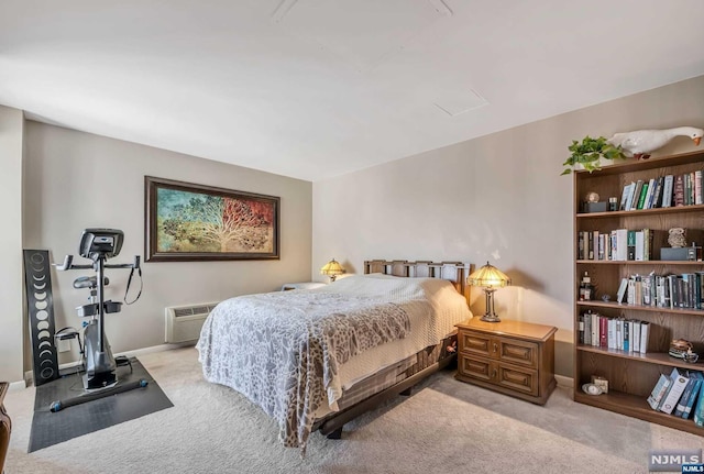 carpeted bedroom with a wall mounted AC