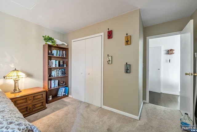 bedroom with a closet and light hardwood / wood-style floors