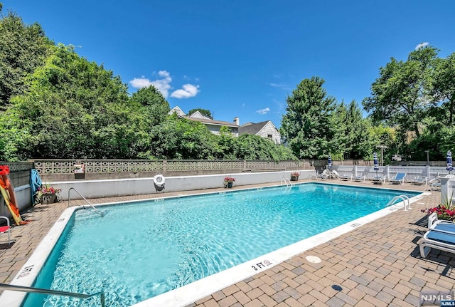 view of pool featuring a patio area