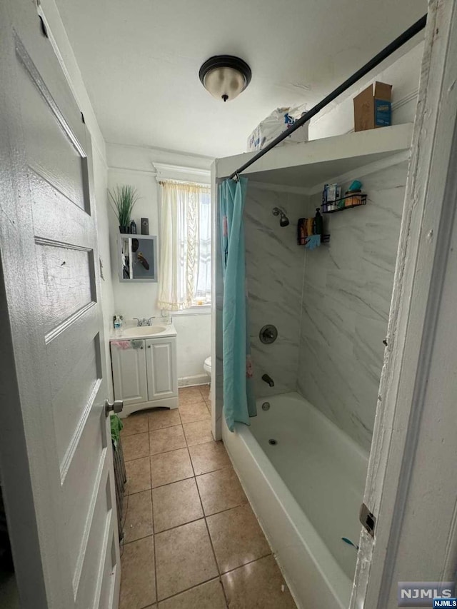 full bathroom featuring toilet, tile patterned flooring, shower / bathtub combination with curtain, and vanity