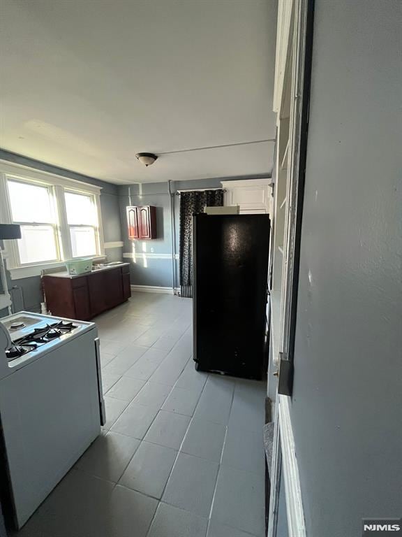 kitchen with white gas stove