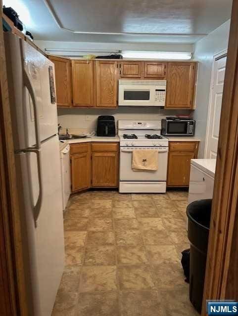 kitchen featuring white appliances