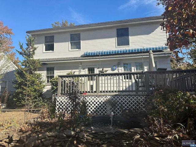 rear view of property with a deck