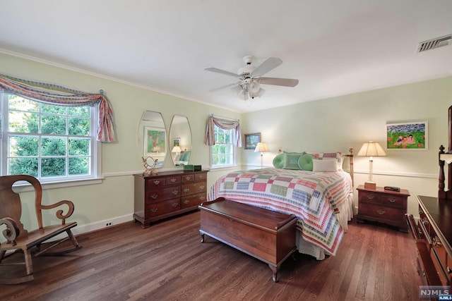 bedroom featuring ceiling fan, dark hardwood / wood-style floors, and ornamental molding