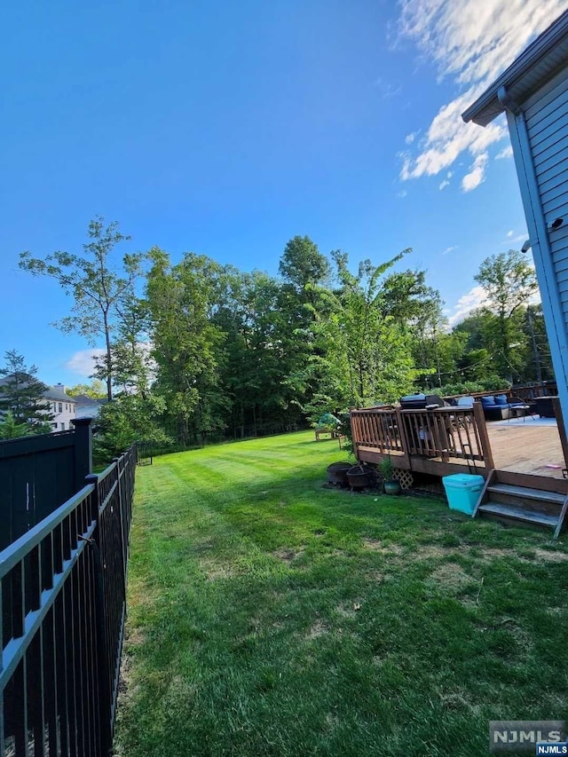 view of yard with a deck