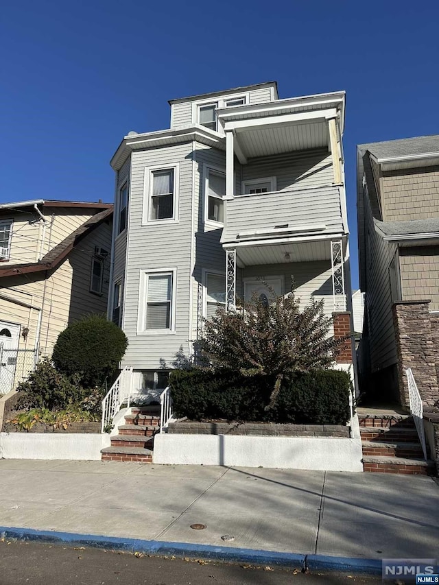 view of front of property with a balcony