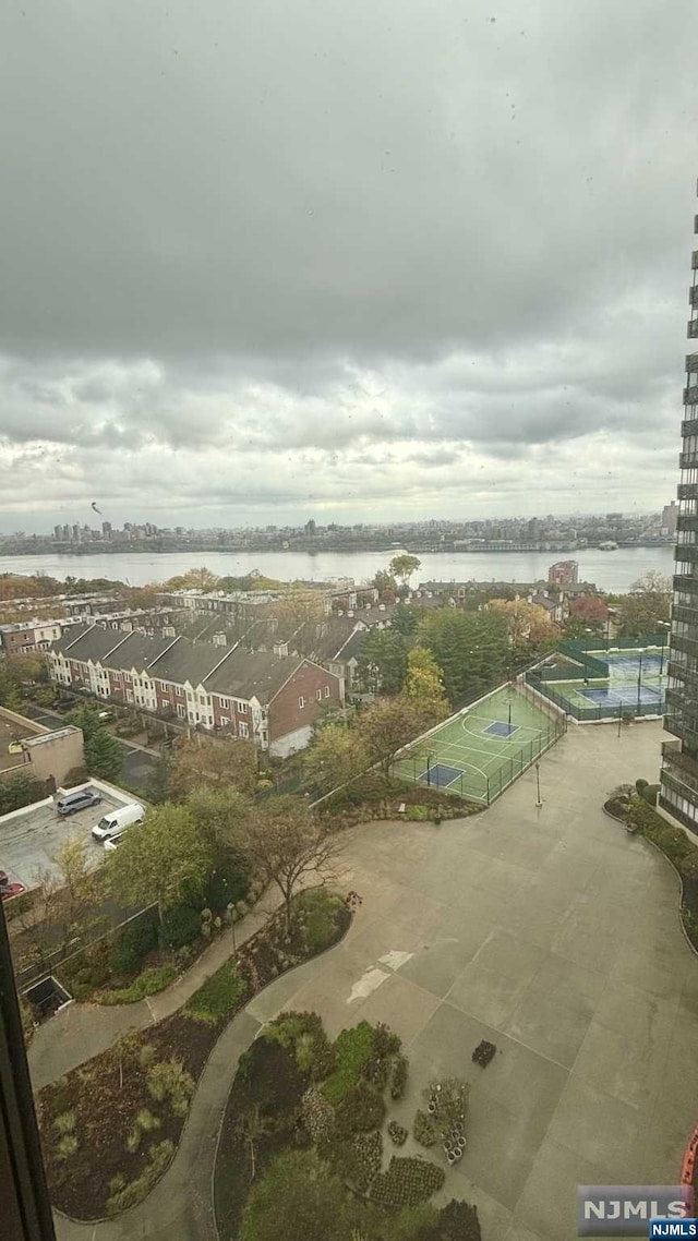 birds eye view of property featuring a water view