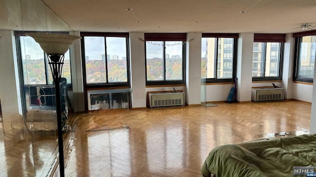 sunroom with an AC wall unit and plenty of natural light