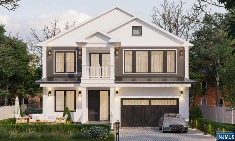 view of front of home with a balcony and a garage