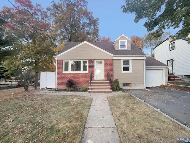 view of front facade featuring a front lawn and a garage