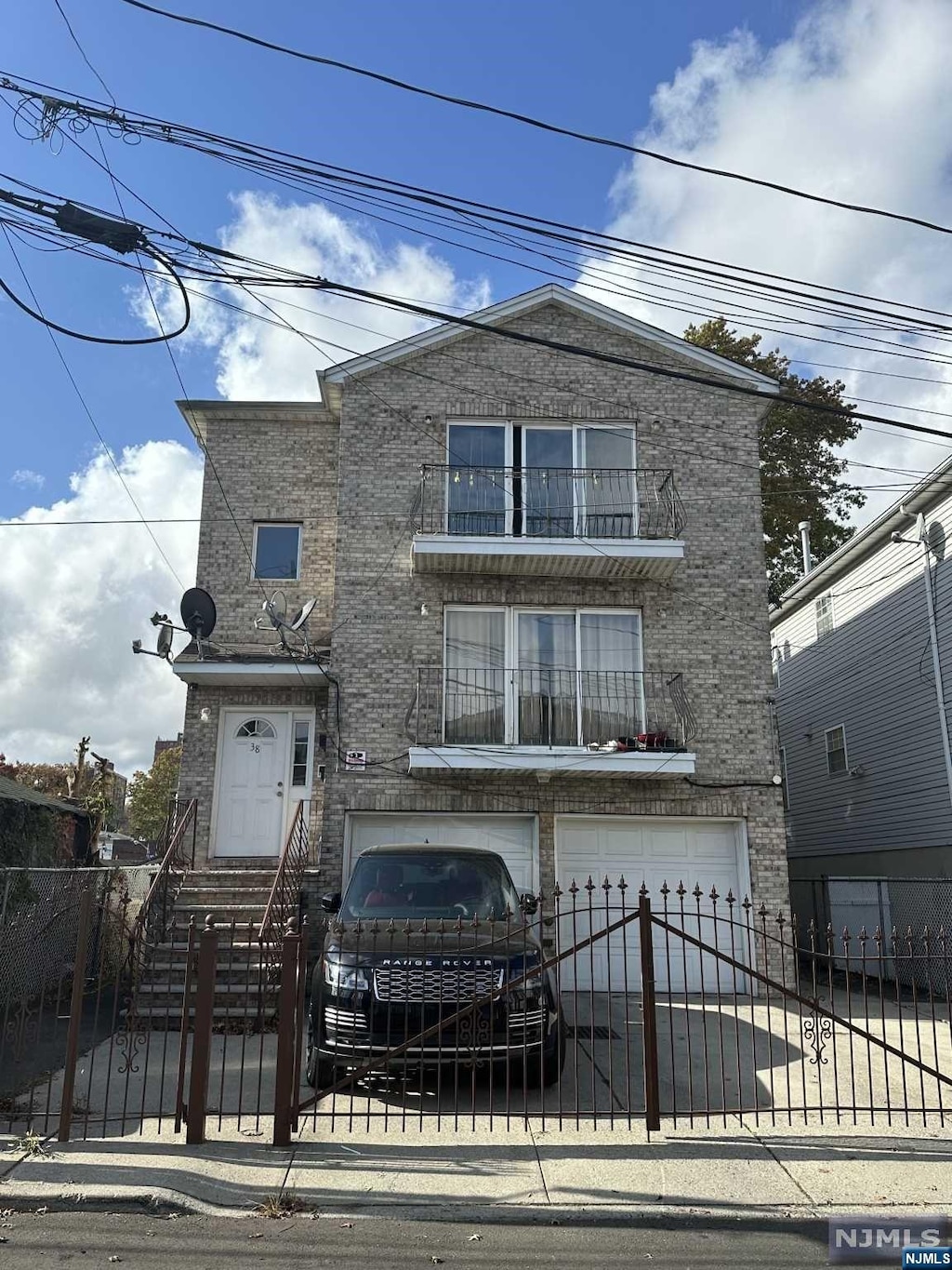 view of front of house with a balcony and a garage