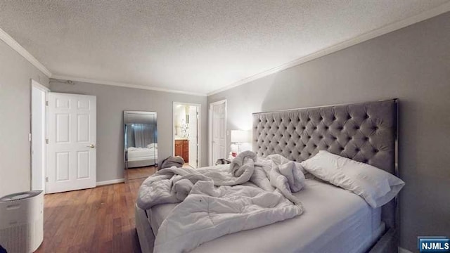 bedroom with hardwood / wood-style floors, ensuite bathroom, crown molding, and a textured ceiling