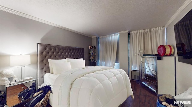 200 Winston Dr Unit 418, Cliffside Park, NJ 07010 - bedroom with crown molding, a textured ceiling, and wood finished floors