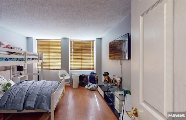 200 Winston Dr Unit 418, Cliffside Park, NJ 07010 - bedroom featuring a textured ceiling and hardwood / wood-style flooring