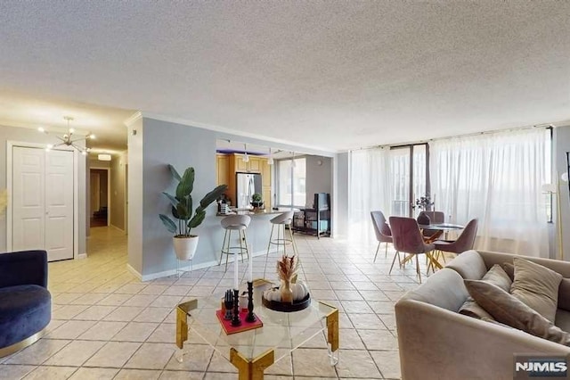 200 Winston Dr Unit 418, Cliffside Park, NJ 07010 - living area with light tile patterned floors, a textured ceiling, and a chandelier