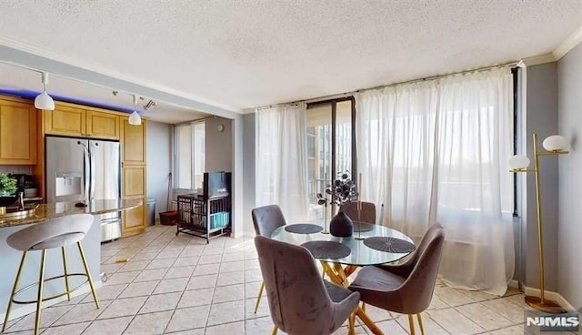 200 Winston Dr Unit 418, Cliffside Park, NJ 07010 - dining area with a textured ceiling, light tile patterned flooring, and ornamental molding