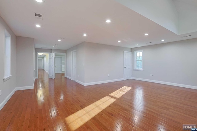 unfurnished room with light hardwood / wood-style floors