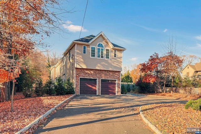 view of side of property featuring a garage