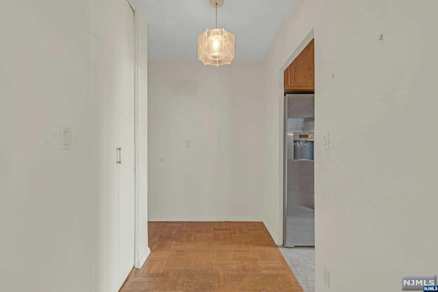 corridor featuring light parquet flooring