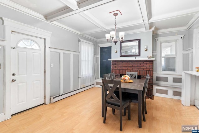 dining room with a baseboard radiator, light hardwood / wood-style flooring, plenty of natural light, and coffered ceiling