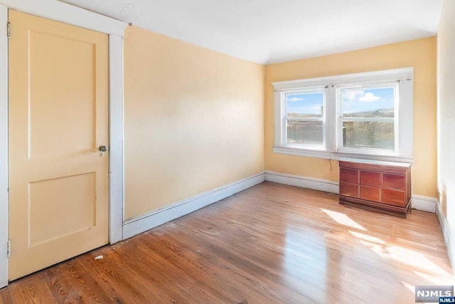 unfurnished room featuring light hardwood / wood-style flooring