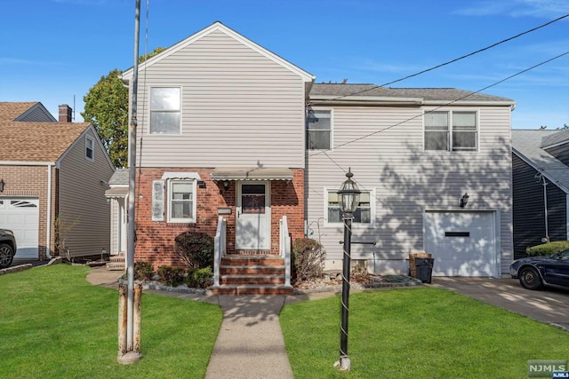 view of front of house featuring a garage and a front lawn