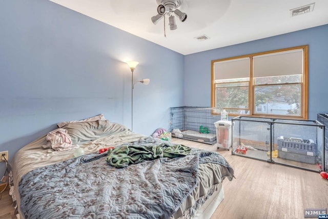 bedroom featuring ceiling fan and wood-type flooring