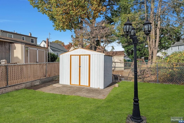 view of outbuilding with a yard